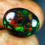 6.47 ct Fantastic Oval Cabochon (15.85 x 12.19 mm) Ethiopian Flashing Black Opal