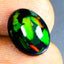 3.14 ct Oval Cabochon (13.06 x 9.80 mm) Flashing Natural Black Opal Stone