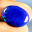 8.41 ct Oval Cabochon (19.90 x 14.47 mm) Multi Color Flashing Black Opal