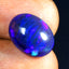 3.74 ct Oval Cabochon (13.64 x 10.43 mm) Ethiopian Flashing Black Opal