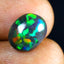 2.12 ct Oval Cabochon (11.97 x 9.69 mm) Flashing Black Opal Gemstone
