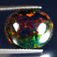 4.94 ct Superb Oval Cabochon (14.18 x 11.86 mm) Ethiopian Flashing Black Opal