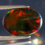 3.98 ct Sparkling Oval Cabochon (14.13 x 10.03 mm) Ethiopian Flashing Black Opal