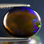 3.40 ct Oval Cabochon(12.40 x 10.11 mm)Ethiopian 360 Degree Flashing Black Opal