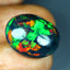 12.27 ct Oval Cabochon (18.91 x 15.38 mm) Flashing Black Opal Gemstone