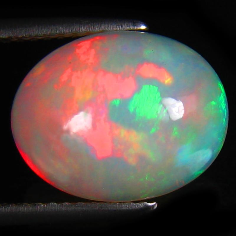 4.72 ct Eye-catching Oval Cabochon (14 x 11 mm) Ethiopian 360 Degree Flashing Rainbow Opal Natural Gemstone