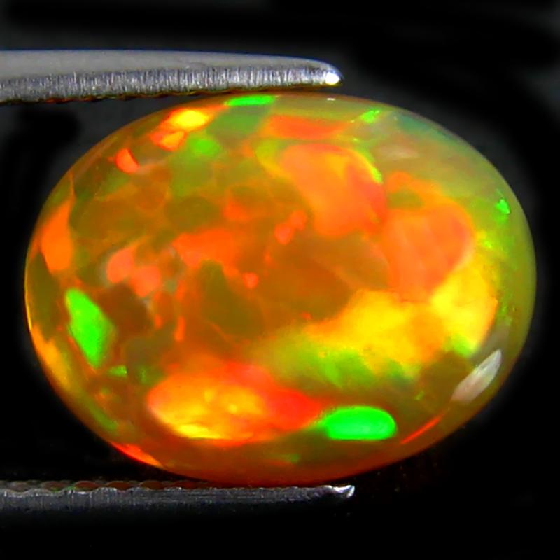 4.04 ct Great looking Oval Cabochon (13 x 10 mm) Ethiopian 360 Degree Flashing Rainbow Opal Natural Gemstone