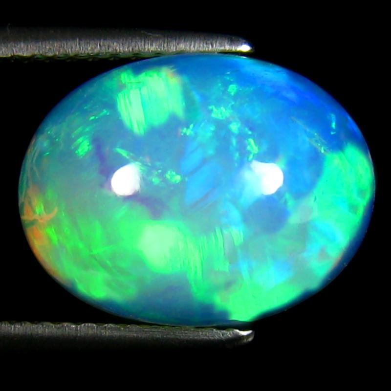 4.54 ct Phenomenal Oval Cabochon (14 x 11 mm) Ethiopian 360 Degree Flashing Rainbow Opal Natural Gemstone