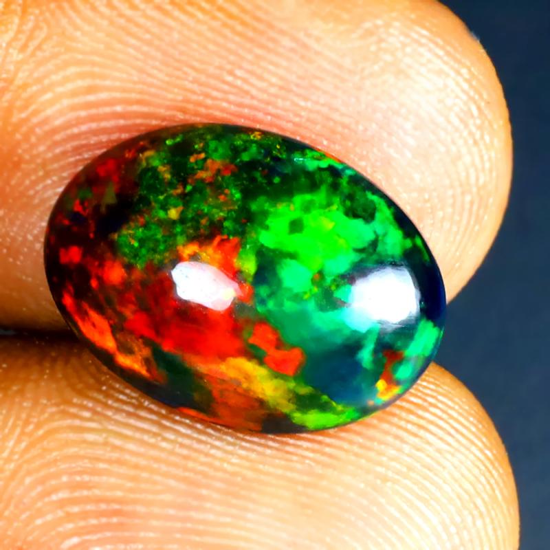 3.95 ct Fair Oval Cabochon (15 x 11 mm) Ethiopian 360 Degree Flashing Black Opal Natural Gemstone