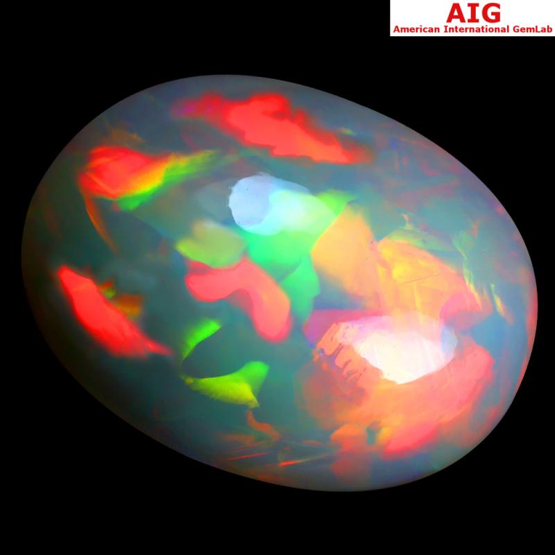 28.61 ct AIG CERTIFIED SHIMMERING OVAL CABOCHON CUT (25 X 19 MM) FLASHING 360 DEGREE MULTICOLOR RAINBOW OPAL