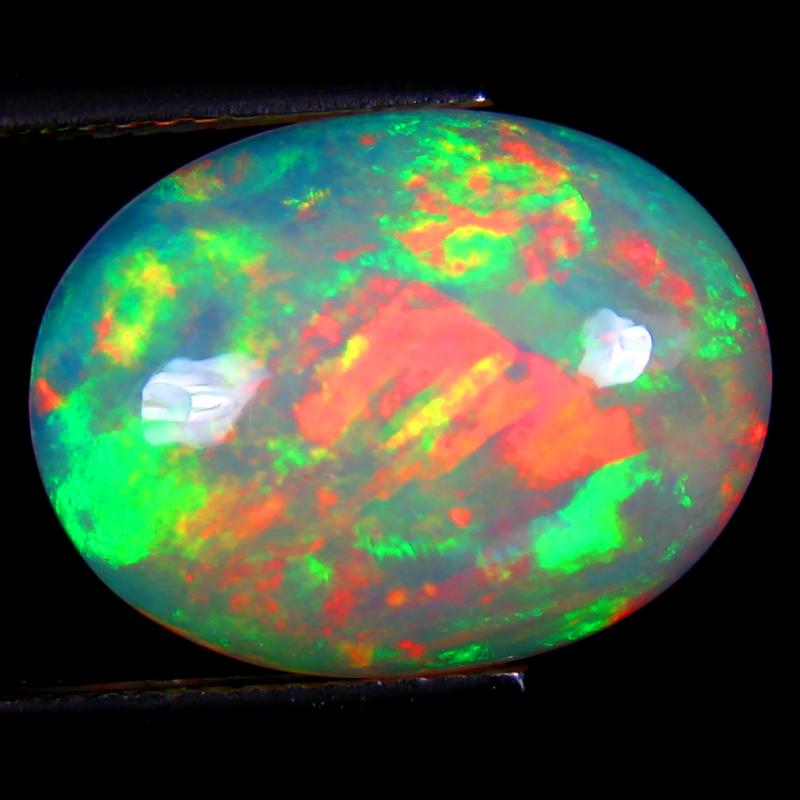 5.48 ct Tremendous Oval Cabochon (16 x 12 mm) Flashing 360 Degree Multicolor Rainbow Opal Gemstone