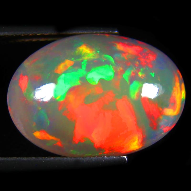 8.58 ct Fair Oval Cabochon (19 x 13 mm) Flashing 360 Degree Multicolor Rainbow Opal Gemstone