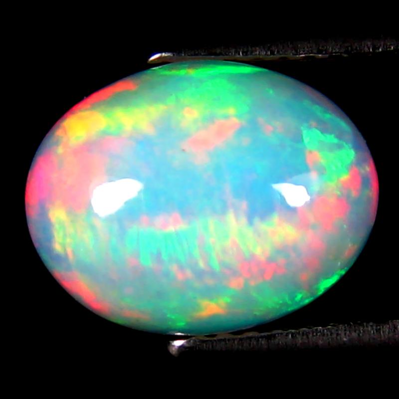 2.91 ct Eye-catching Oval Cabochon (11 x 9 mm) Ethiopian 360 Degree Flashing Rainbow Opal Natural Gemstone